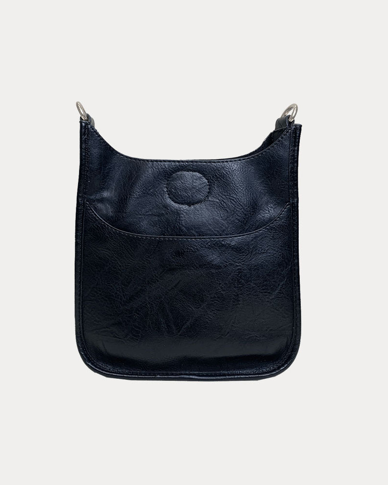 Mini Vegan Leather Messenger in Black with Silver hardware on a grey background.