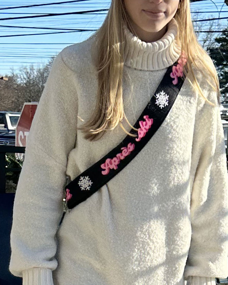woman wearing apres ski printed ski bunny strap in pink