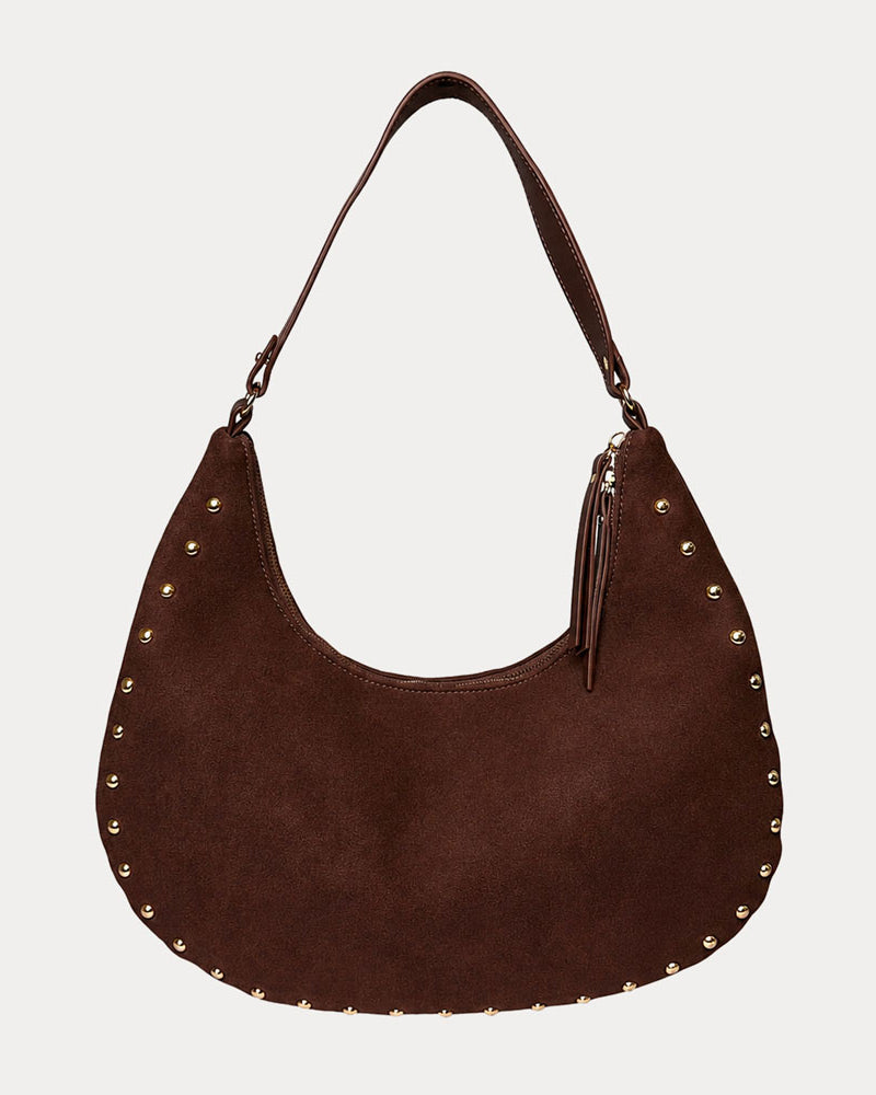 Chocolate vegan suede handbag with studs on a light gray background
