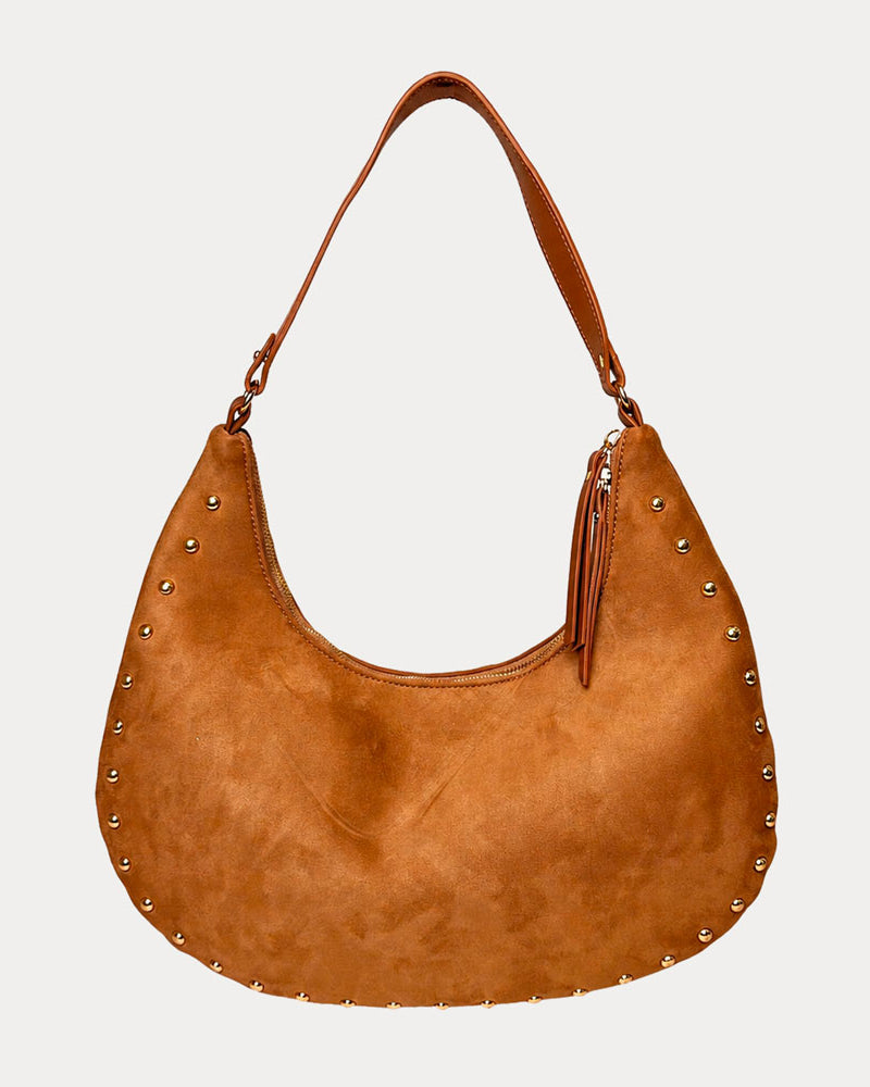 Camel vegan suede handbag with studs on a light gray background