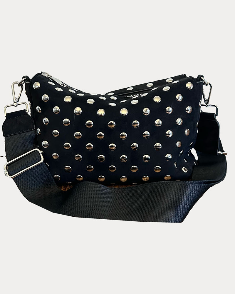 Black bag with silver studs on a light gray background