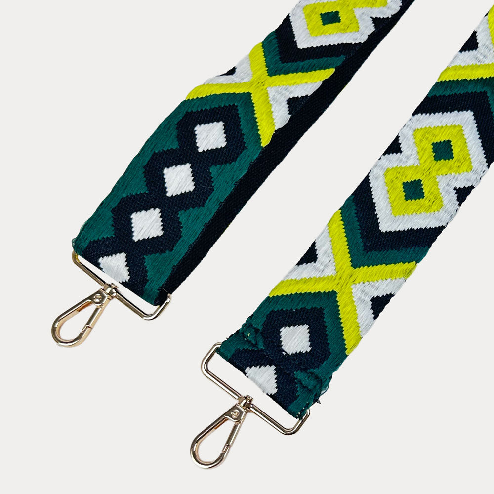 Geometric patterned strap with metal clasps on a white background
