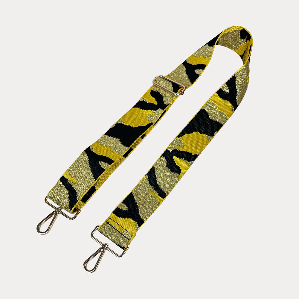 Yellow and black camouflage patterned strap with metal hooks on a white background