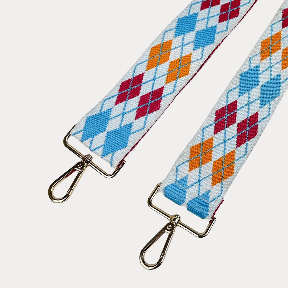 White, Orange, Pink, Blue Argyle Pattern Bag Strap with gold metal clasps on a white background