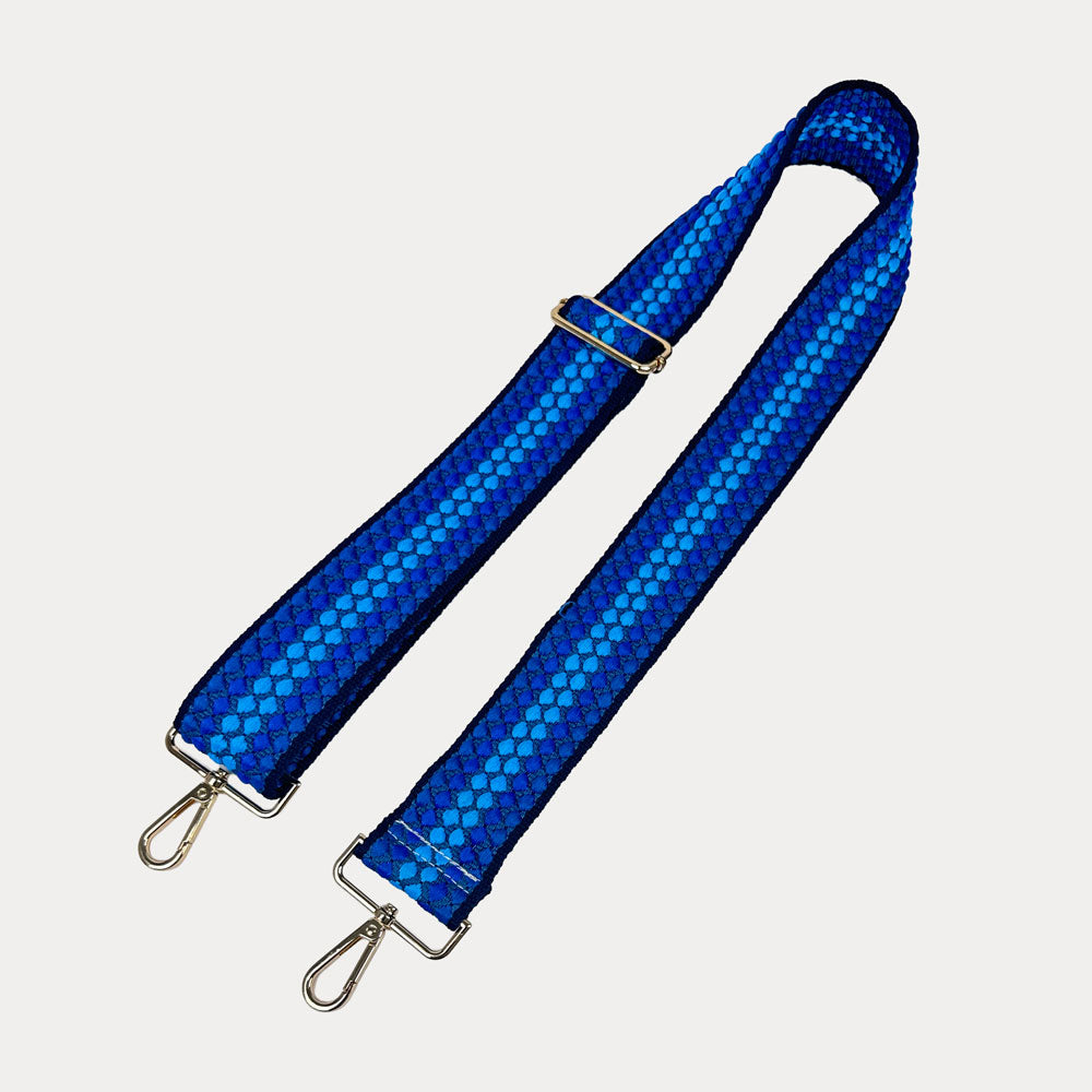 Royal Blue and Bright Blue patterned bag strap on a light gray background
