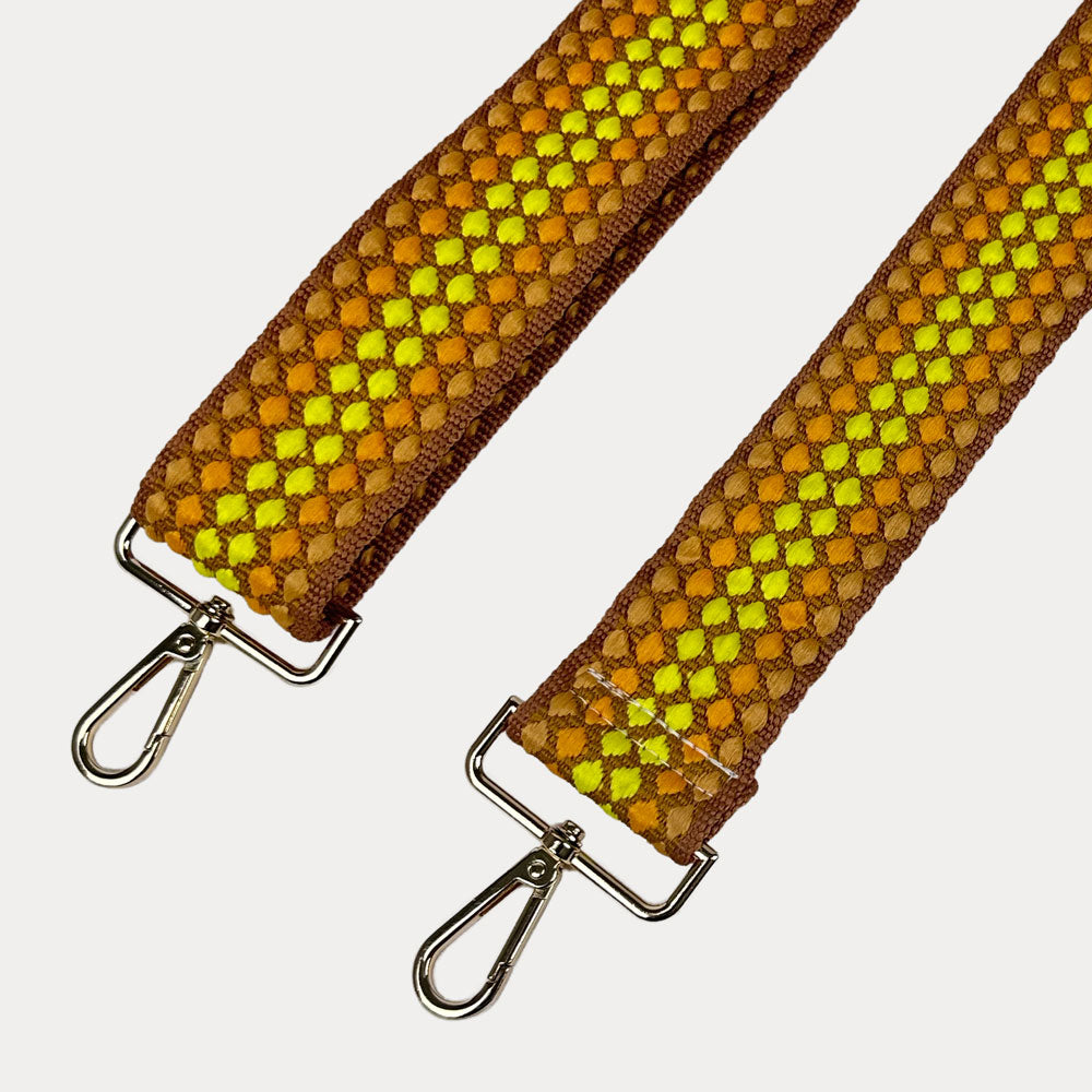 Yellow and brown patterned bag strap with gold metal clasp trim