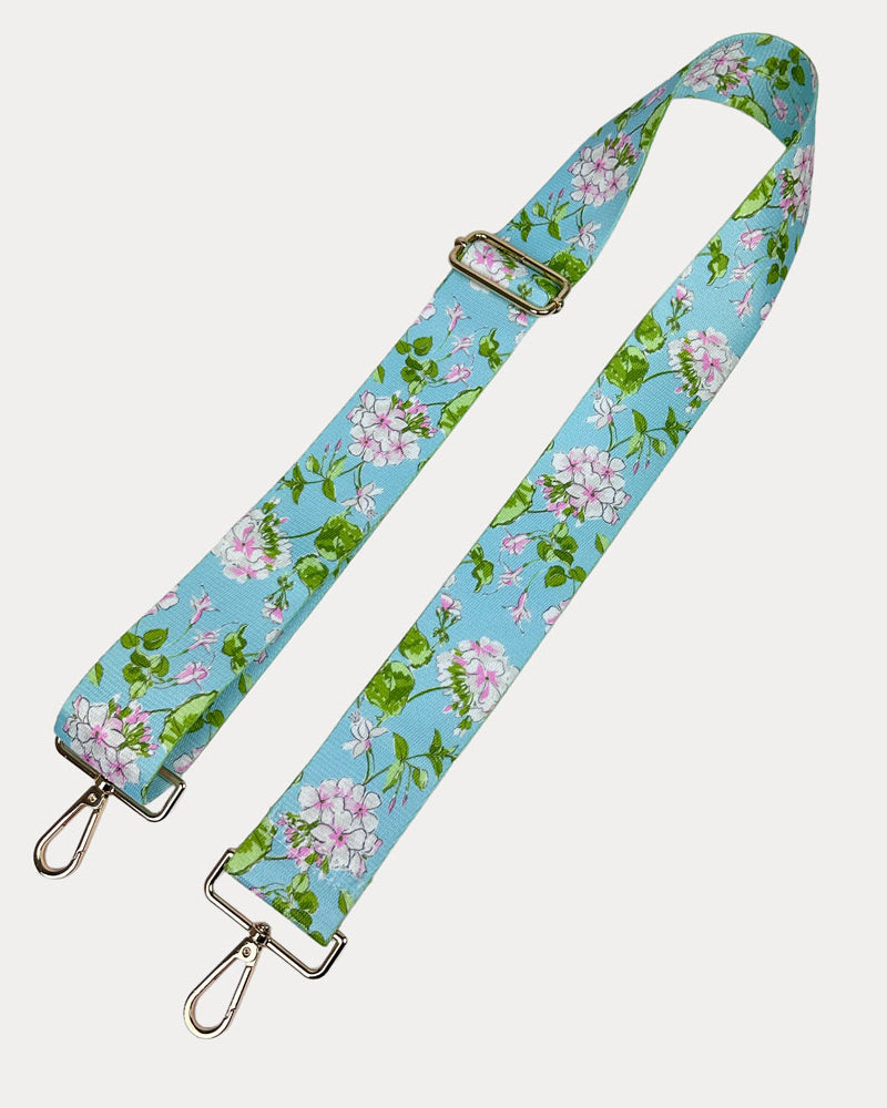 Aqua Ground Floral patterned strap with gold metal clasps on a white background