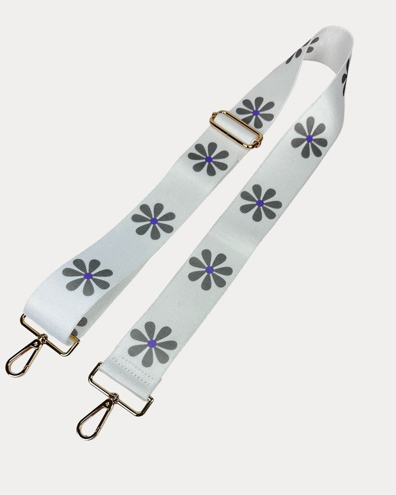 White ground with Grey Flower Print bag strap with gold metal clasps on light grey background