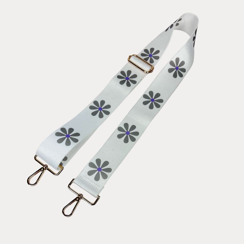 White ground with Grey Flower Print bag strap with gold metal clasps on light grey background