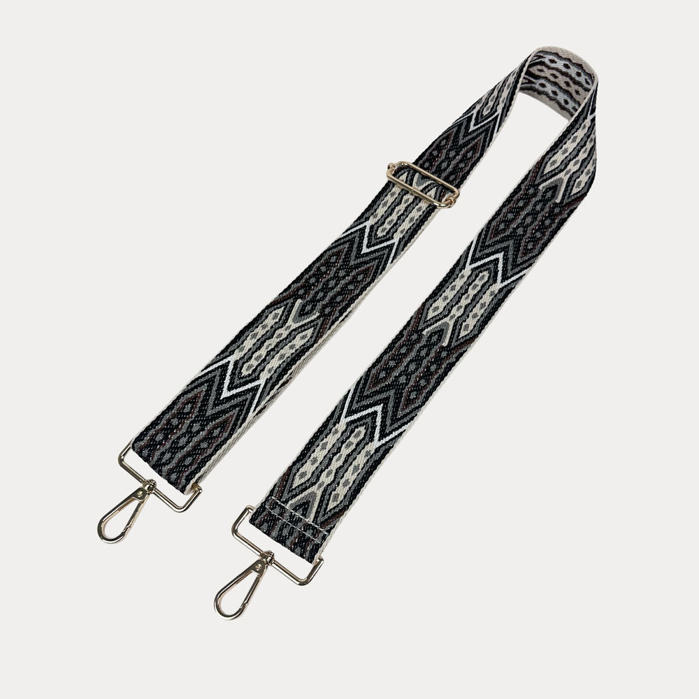 Black, Brown, Grey patterned strap with gold hardware on a light grey background