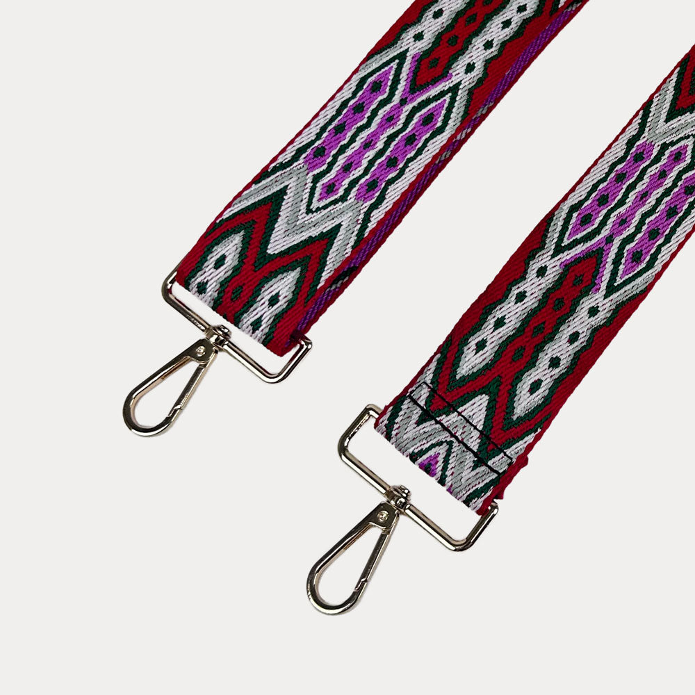 Red, Grey, Pink patterned strap with gold hardware on a light grey background