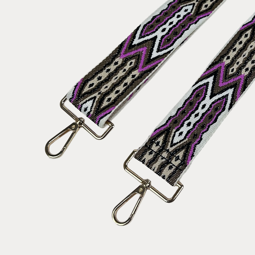 White, Brown, Pink patterned strap with gold hardware on a light grey background