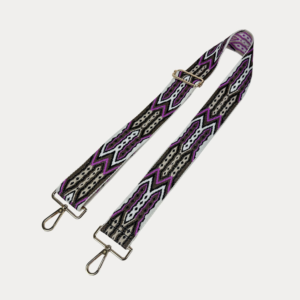 White, Brown, Pink patterned strap with gold hardware on a light grey background