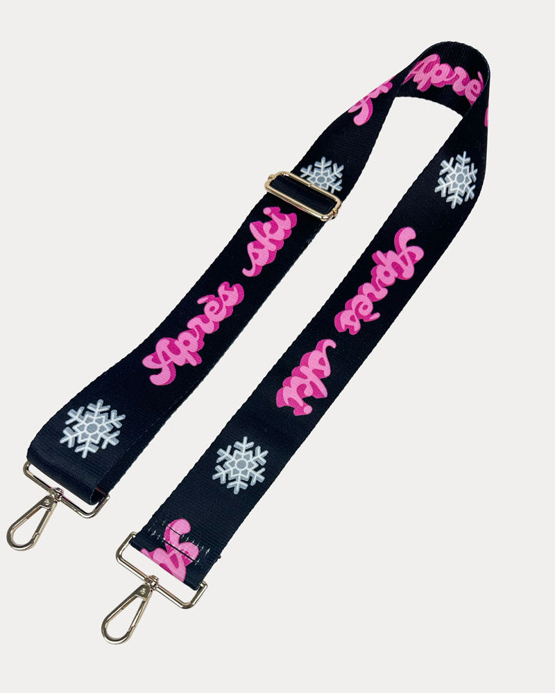 Black ground with Apres Ski text in Pink and white snowflakes printed bag strap with gold hardware