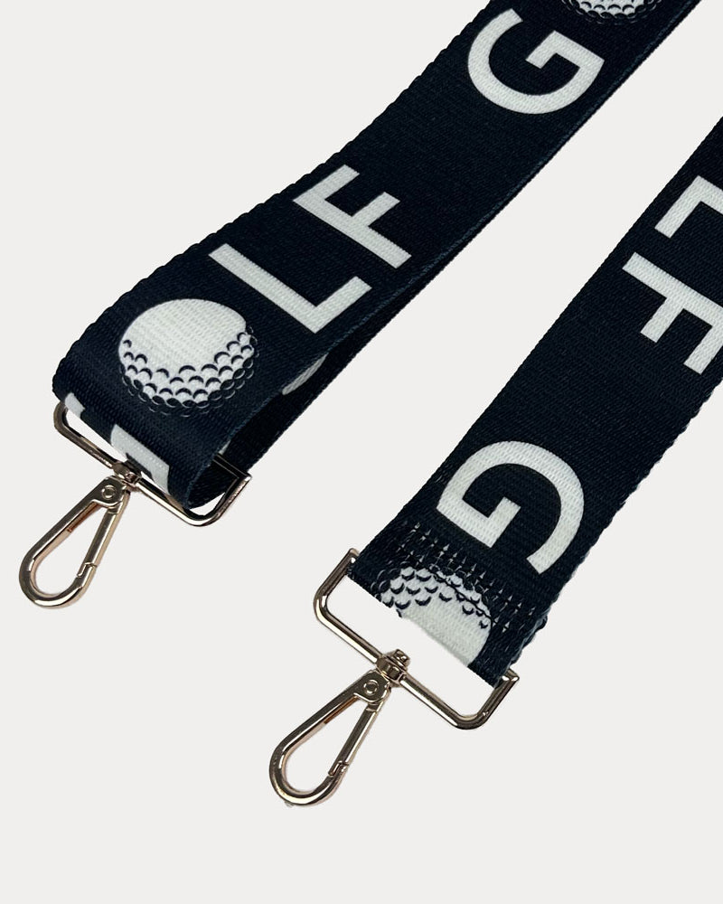 Black ground with text Golf graphics with gold hardware bag strap