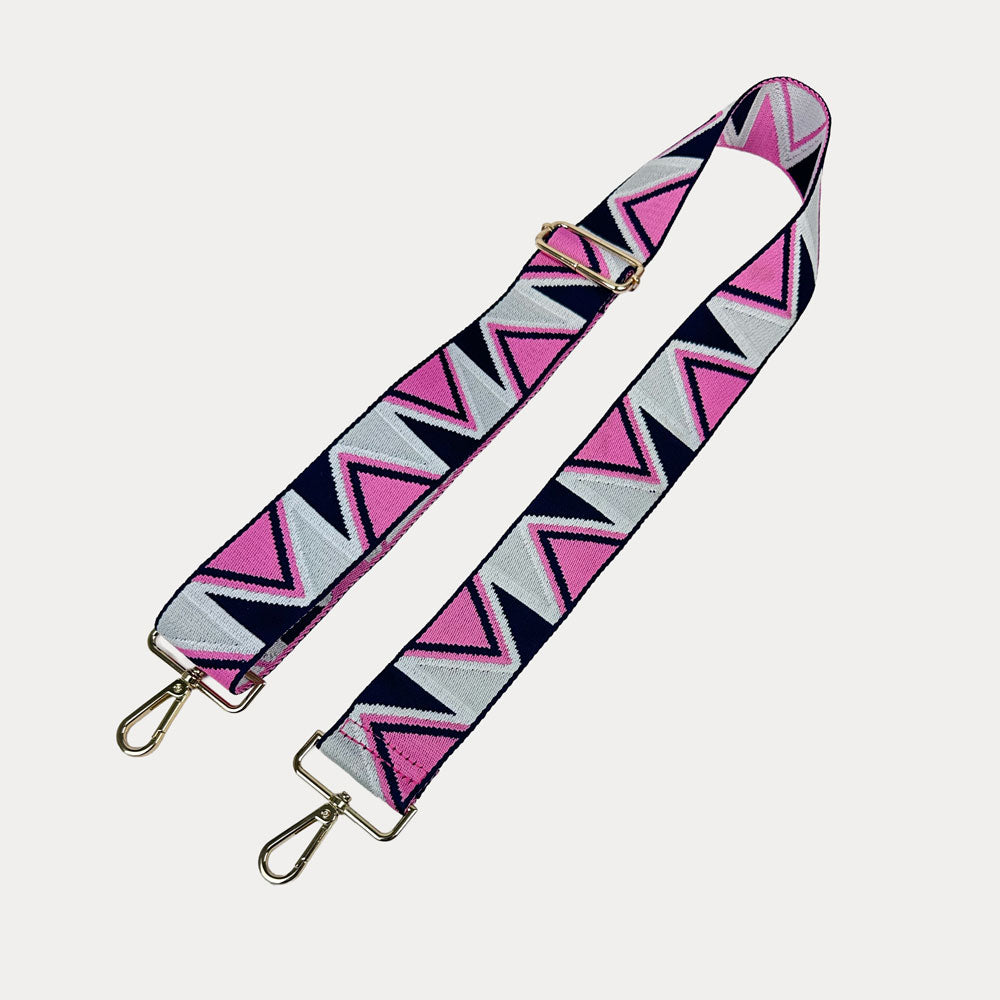 Pink, Navy, and grey Zip Zag Patterned bag strap with gold hardware on a light gray background