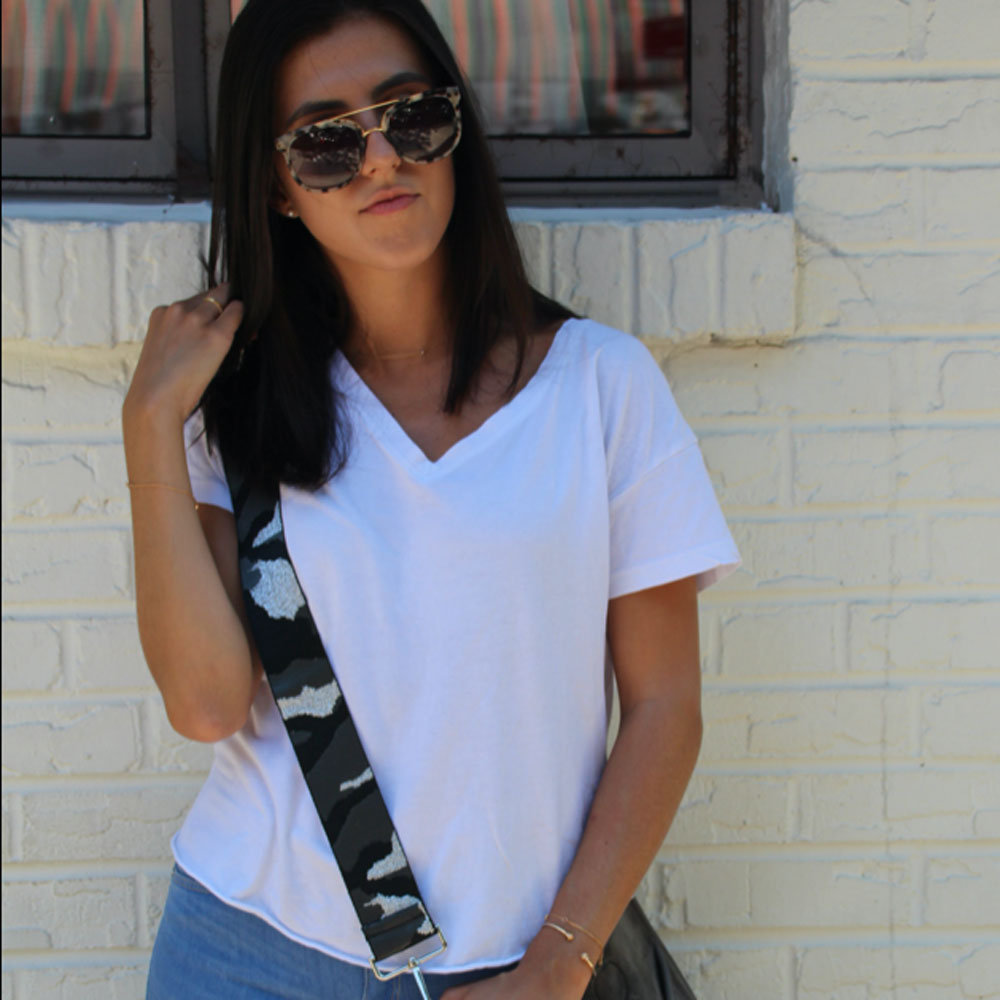 woman wearing grey woven camo bag strap
