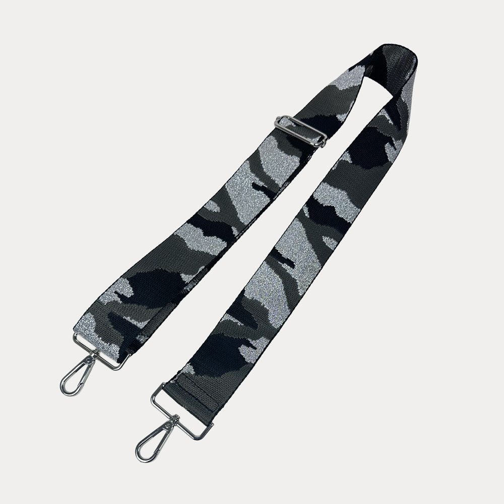 Black and gray camouflage patterned strap with metal clasps on a light gray background