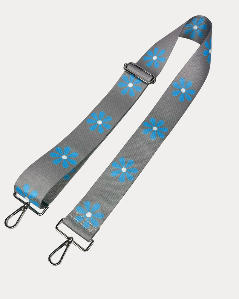Grey ground with Light Blue Flower Print bag strap with silver metal clasps on light grey background