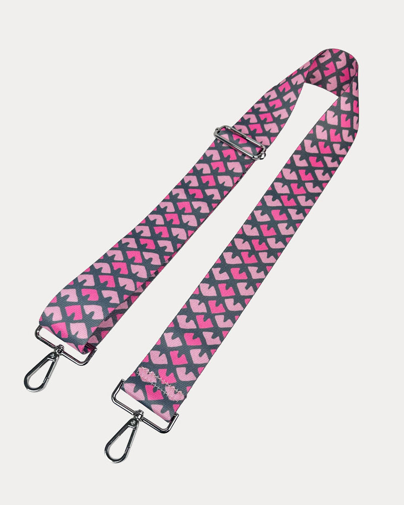 Pink & Grey Patterned strap with silver hardware on a light gray background