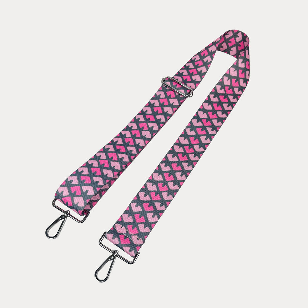 Pink & Grey Patterned strap with silver hardware on a light gray background