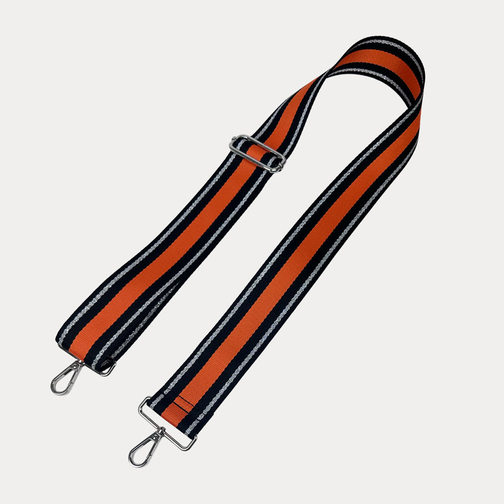 Orange, Navy, and Silver Metallic Striped bag strap with silver hardware on a light gray background