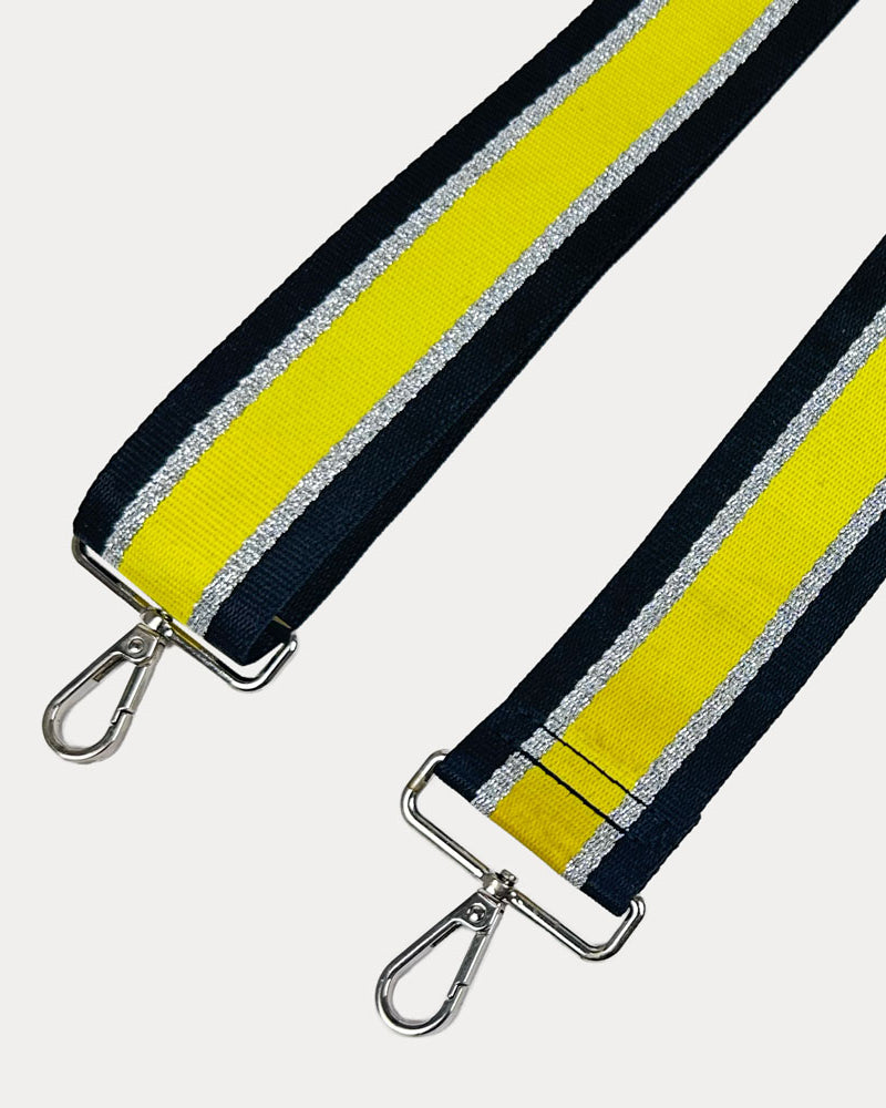 Black, Yellow, and Silver Metallic Striped bag strap with silver hardware on a light gray background