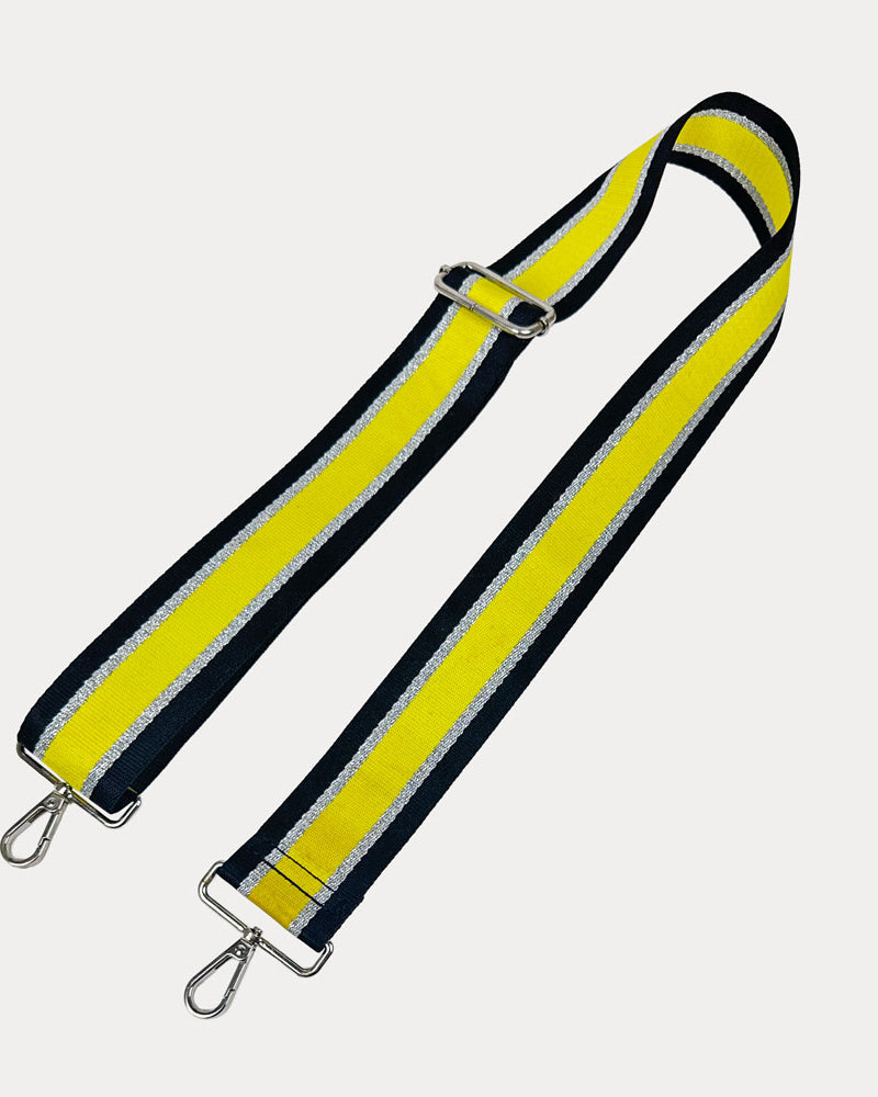 Black, Yellow, and Silver Metallic Striped bag strap with silver hardware on a light gray background