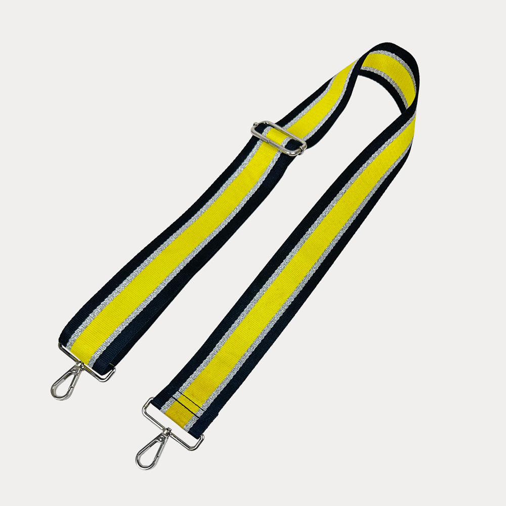 Black, Yellow, and Silver Metallic Striped bag strap with silver hardware on a light gray background