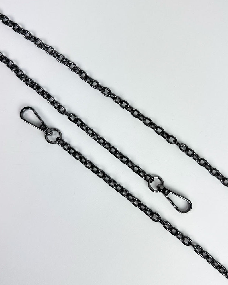 Gunmetal metal chain strap on a light grey background