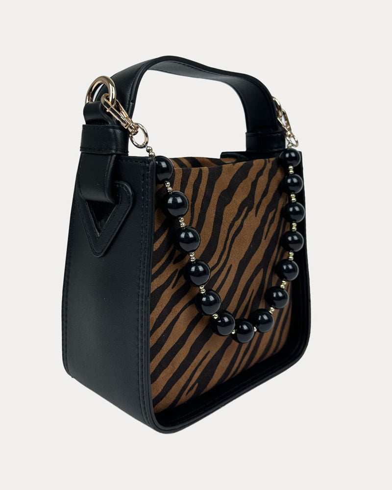Handbag with Zebra Print and Black Vegan Leather Details with Black Bead Trim. Side View