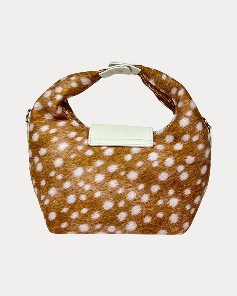 Handbag with deer print and cream leather accents on a light gray background- Back View