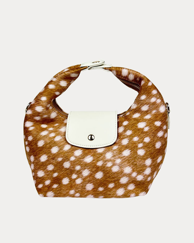 Handbag with deer print and cream leather accents on a light gray background- Front View