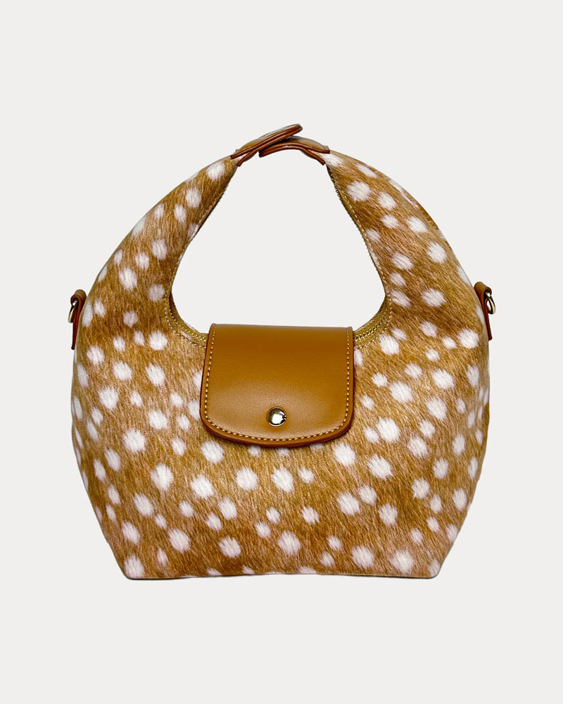 Handbag with deer print and camel leather accents on a light gray background- Front View