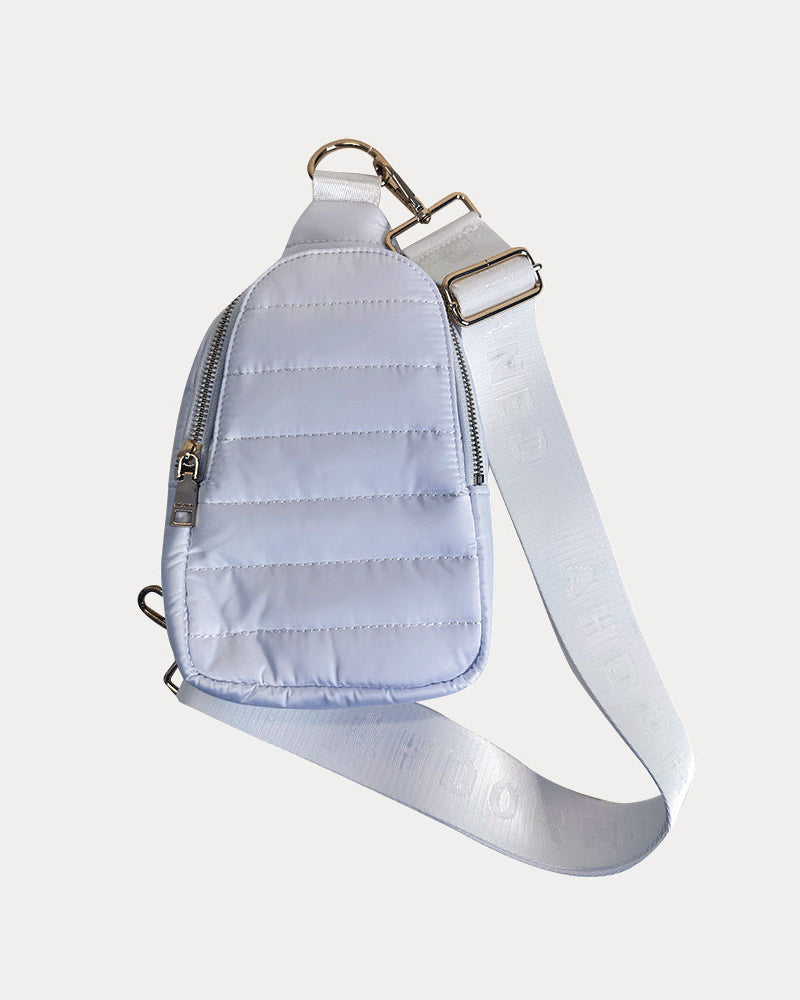 Eliza Quilted Nylon Sling in white, shown with bag strap