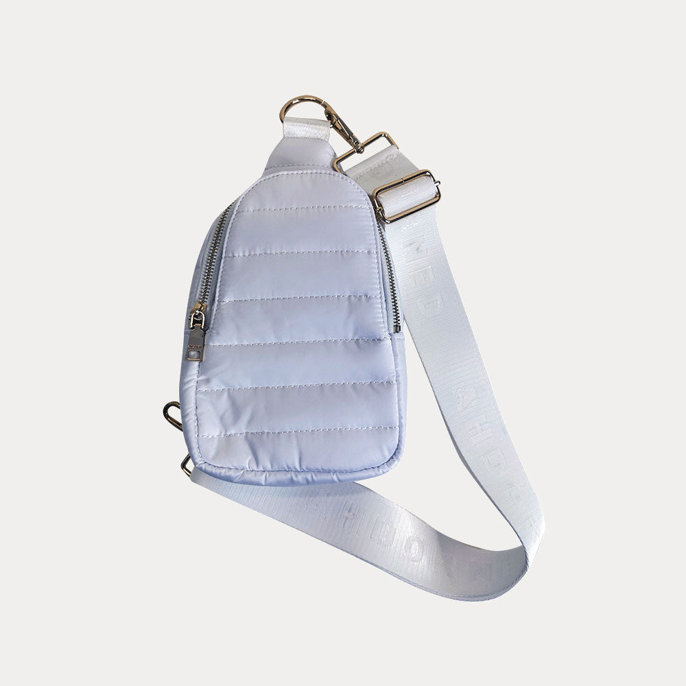 Eliza Quilted Nylon Sling in white, shown with bag strap