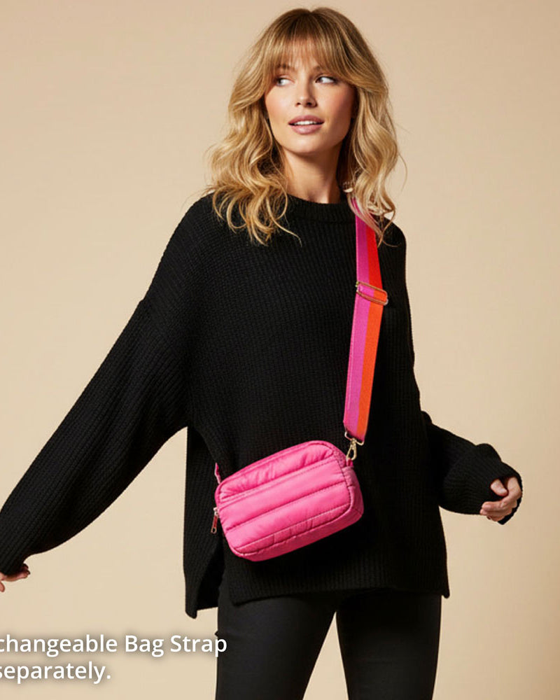 Woman wearing a black outfit with a pink bag on a beige background