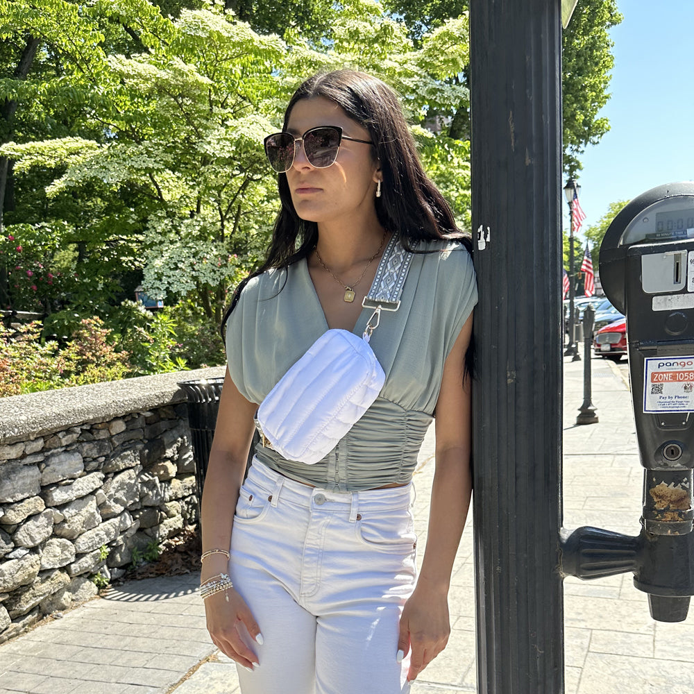 Woman wearing Ella White Quilted Nylon Crossbody Bag