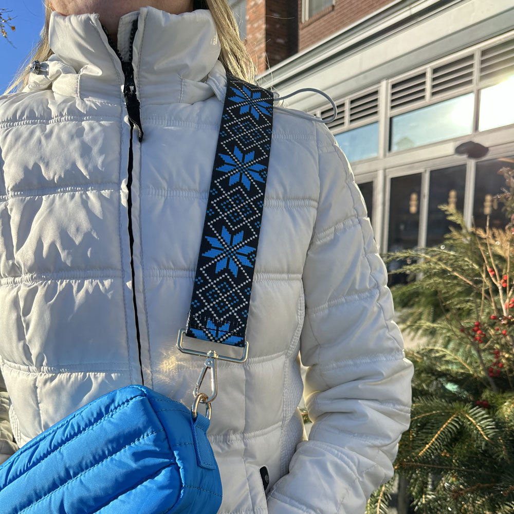 woman wearing printed snowflake bag strap in blue moon