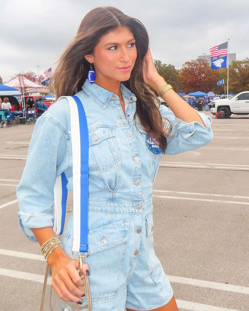 woman wearing royal & white striped game day bag strap with clear game day bag and tailgate