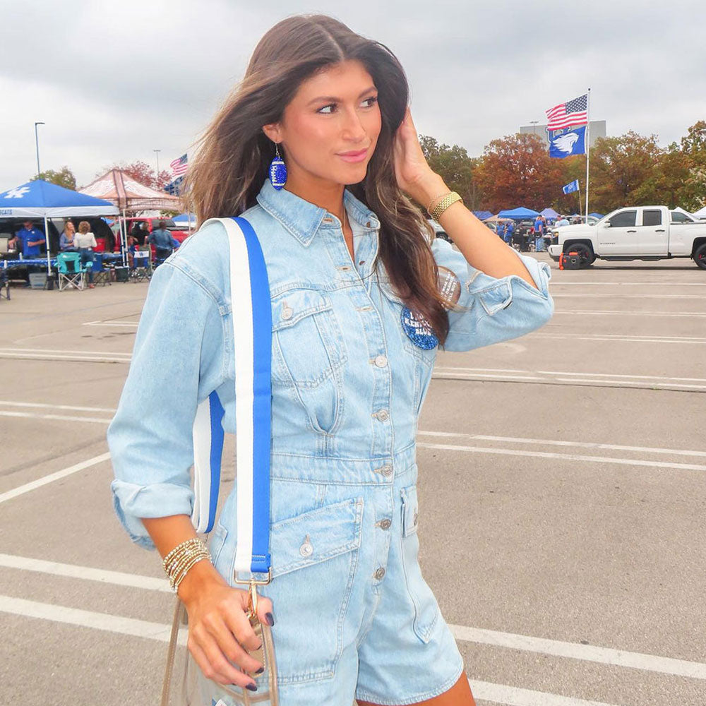 woman wearing royal & white striped game day bag strap with clear game day bag and tailgate