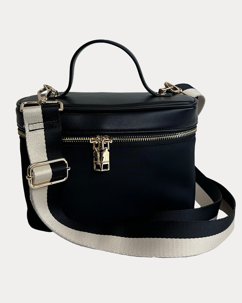 Jenna Crossbody Bag with a Top Handle in Black. Vegan Leather Details with a Cream & Black Striped Bag Strap