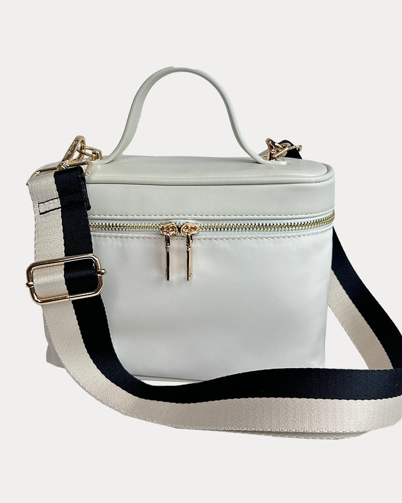 Jenna Crossbody Bag with a Top Handle in Cream. Vegan Leather Details with a Cream & Black Striped Bag Strap