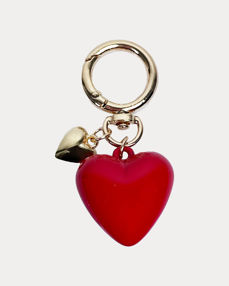 Keychain Heart Charm. Gold Jump Ring to clip to bag. Features a Large Red Heart and Smaller Gold Heart.
