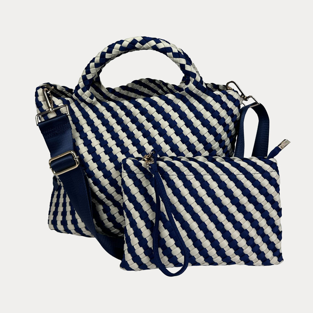 Navy and Ecru striped Lily Woven Neoprene Tote with matching pouch on a light gray background