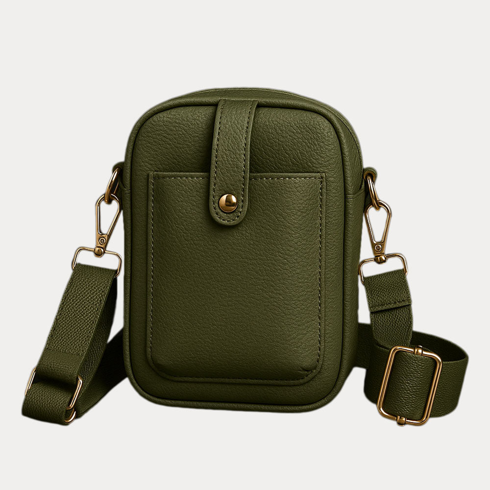 Green leather crossbody bag with gold accents on a light gray background