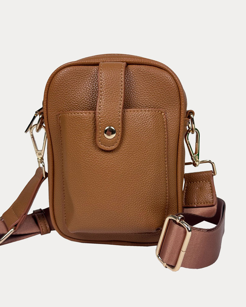 Maya Crossbody in Camel Vegan Pebble Leather with a crossbody bag strap and gold trim.