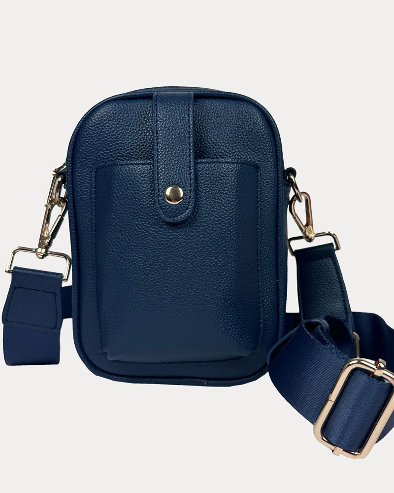 Maya Crossbody in Navy Vegan Pebble Leather with a crossbody bag strap and gold trim.
