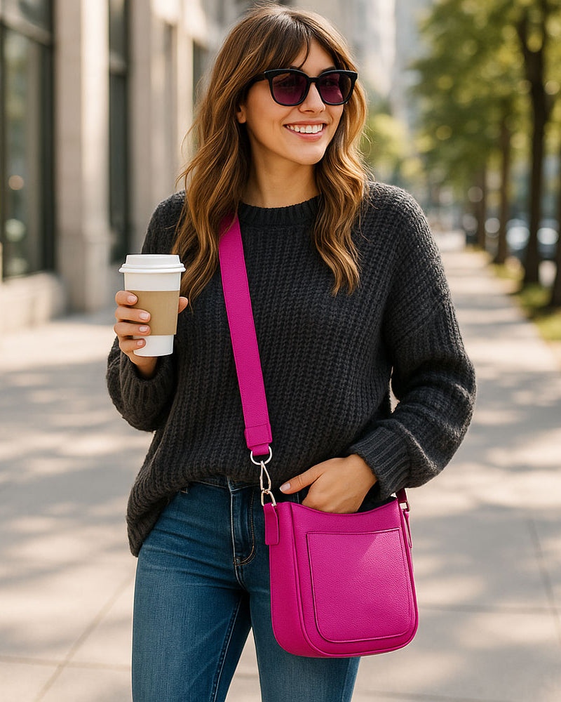 Woman walking outdoors holding a coffee cup and a pink bag