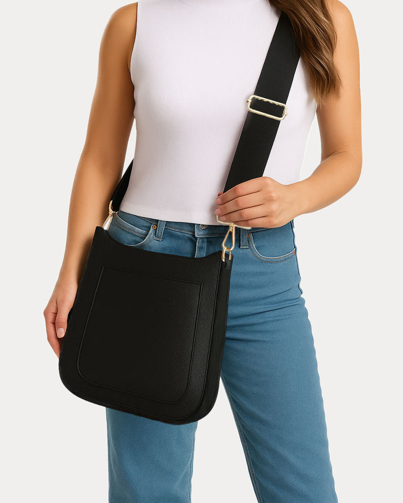 Woman wearing the Maxine Vegan Pebble Leather Messenger in Black as a crosbbody